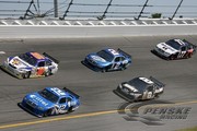 The No. 12, No. 2 and No. 77 Penske Racing cars race at Daytona
